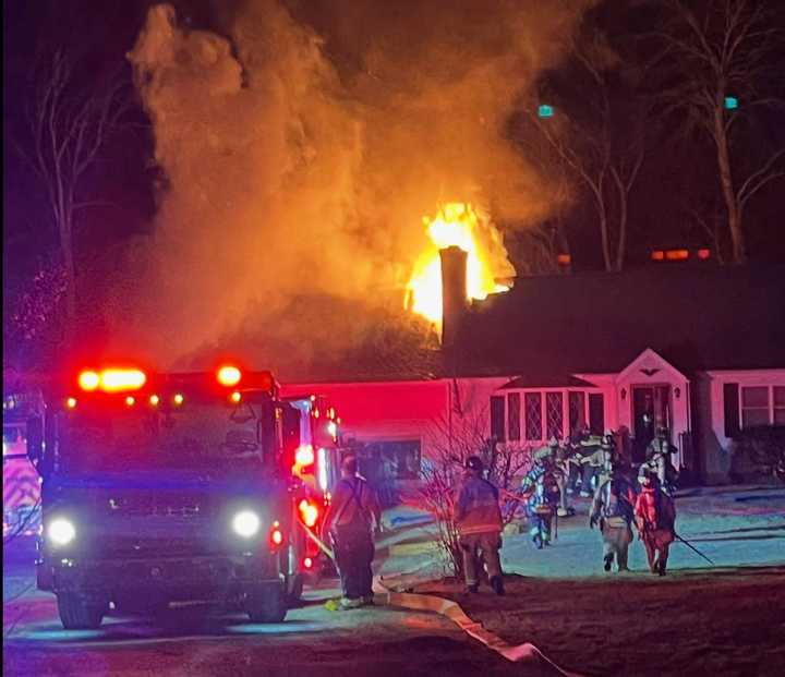 Firefighters battle a blaze at a Newtown home Friday night, Jan. 3. 