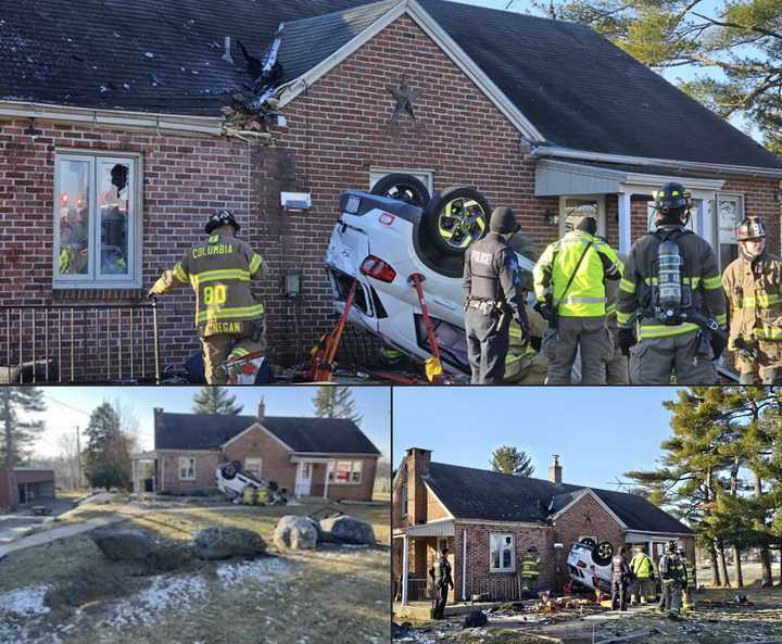 The scene of the car into a brick home. 