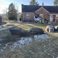 <p>The scene of the car into a brick home</p>