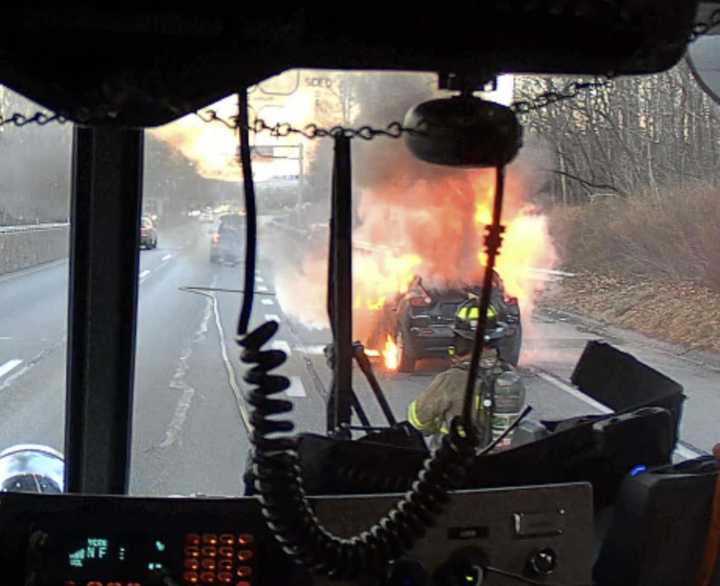 The scene of firefighters battling the car fire on I-83