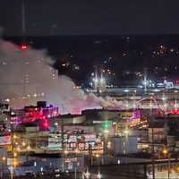 <p>Smoke billows from a Shippon Auto Body in Stamford on Thursday, Feb. 13. </p>