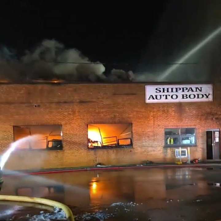 Stamford firefighters battle a fire at Shippan Auto Body Thursday night, Feb. 13. 