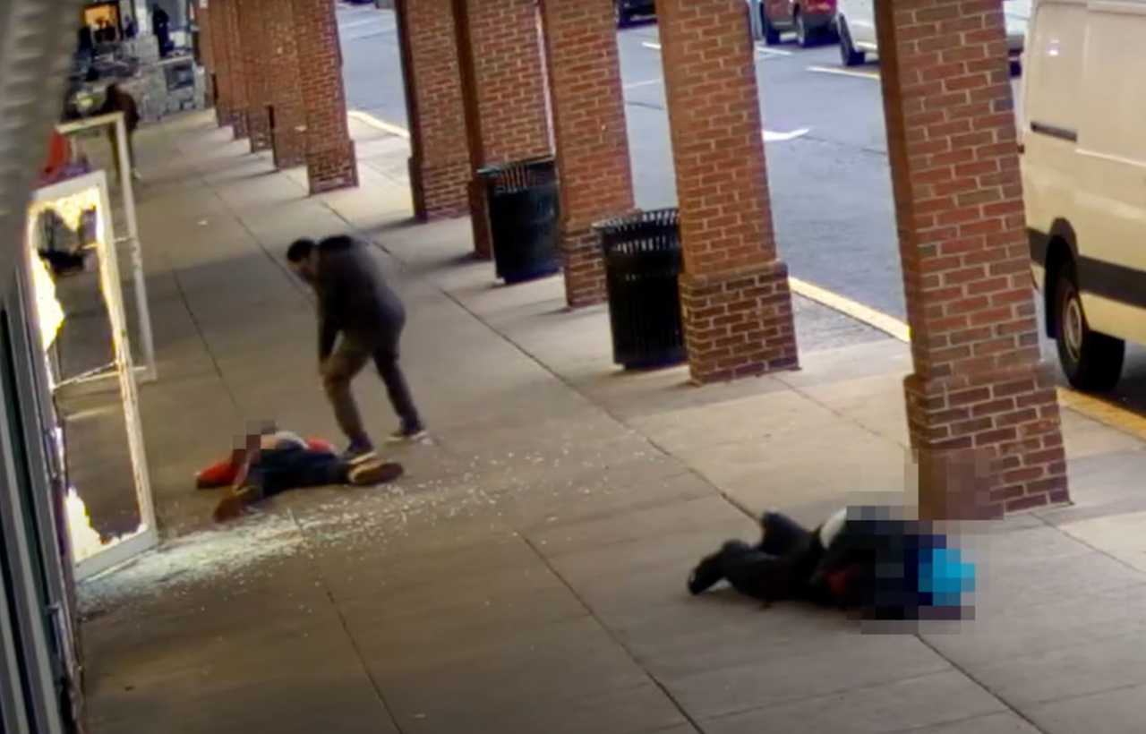 Markus Tyrell Dowdy standing over his victim's body before pistol whipping him.  Markus Tyrell Dowdy standing over his victim's body before pistol whipping him. 
