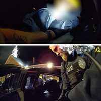 <p>Officers checking on&nbsp;Kelvin Lashawn Baker in the back of the police vehicle.</p>