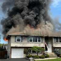 2-Alarm Fire Tears Through Pearl River Home; Officer Hospitalized, Cause Under Investigation