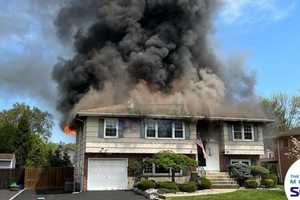 2-Alarm Fire Tears Through Pearl River Home; Officer Hospitalized, Cause Under Investigation