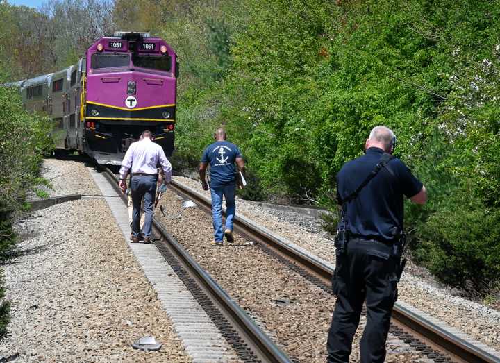 Cohasset police investigate after a pickup truck was hit by a train, killing the driver.