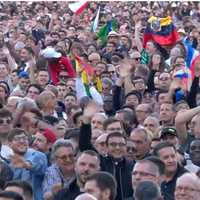 <p>People from nations throughout the world were on hand for the announcement, with many displaying the flags of their countries.</p>