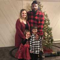 <p>Steven Gill, pictured with his wife Tara and their children.
  
</p>