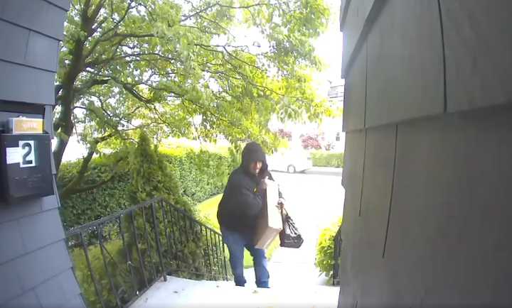 A still from the security footage depicting the suspect stealing packages from a South Regent Street home. 