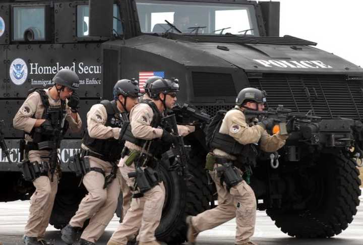 Special Response Team (SRT) members training using an armored vehicle at Fort Benning in Georgia.