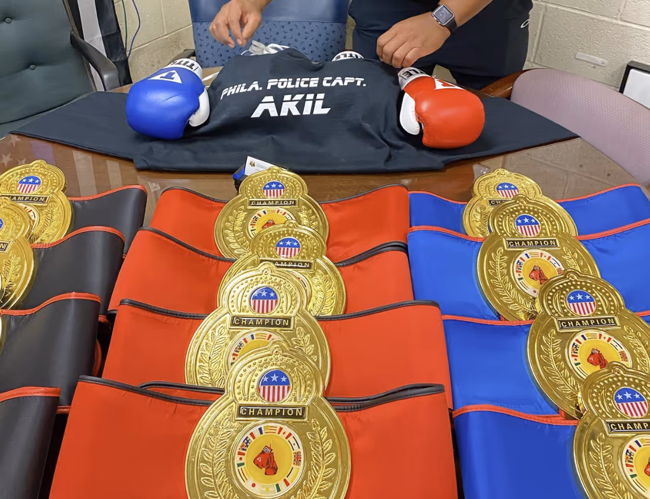 Prize belts former Philadelphia Police Captain Akil was giving out as part of the "Guns Down, Gloves Up" initiative. Prize belts former Philadelphia Police Captain Akil was giving out as part of the "Guns Down, Gloves Up" initiative.