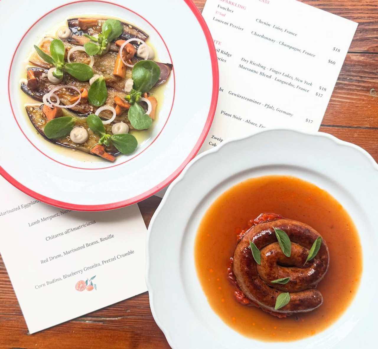 Lamb merguez, Nardello relish and jus; grilled marinated eggplant with roasty chanterelles and purslane; stout sourdough and whipped butter.