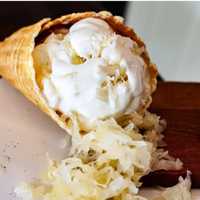 <p>A cone of sauerkraut ice cream at Urban Churn.&nbsp;</p>