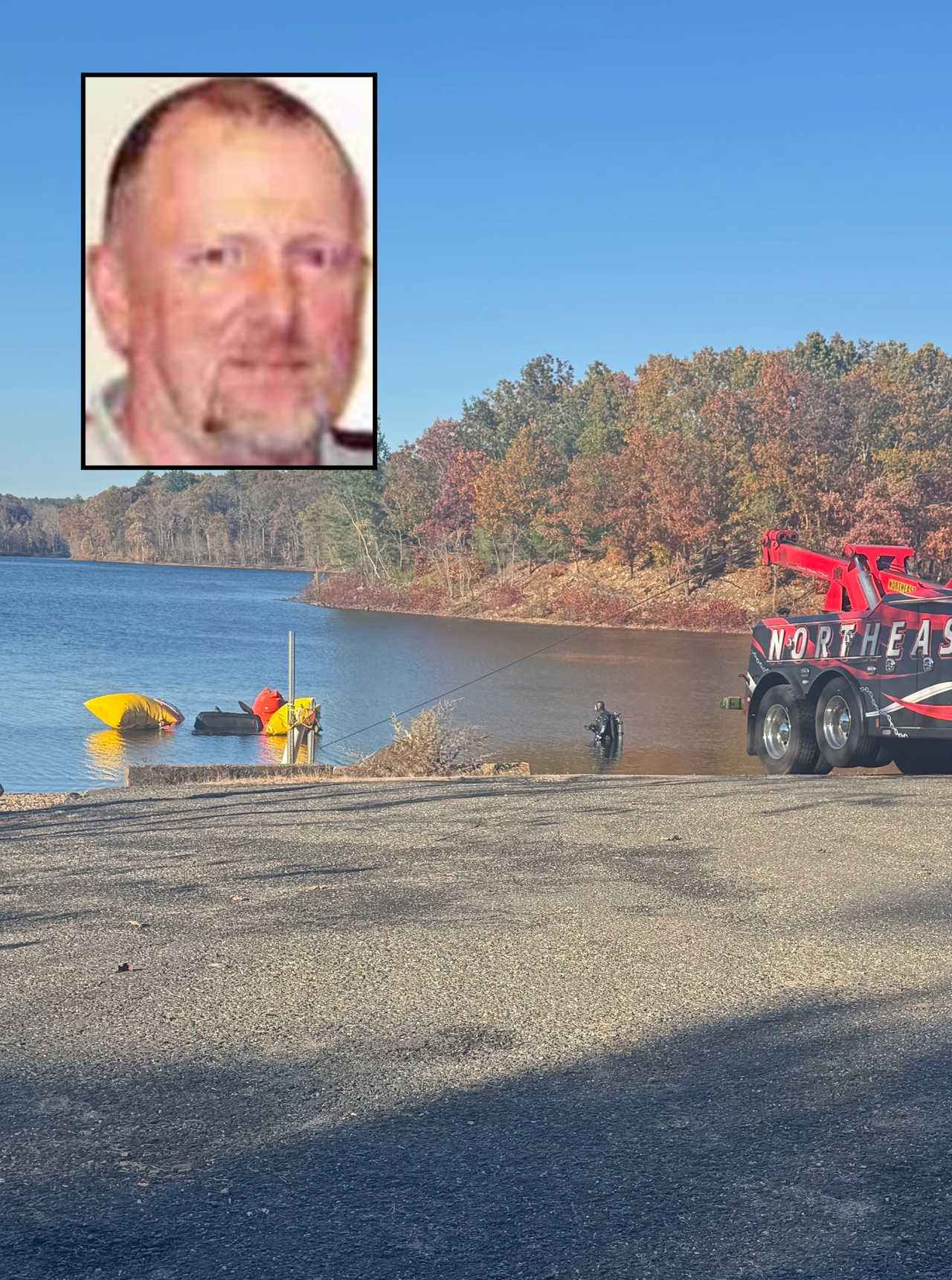 Crews search Mansfield Hollow Lake after a body was found floating in it on Oct. 5. DNA testing later confirmed it was Robert Cavanaugh, who had been missing since Christmas Eve 2004.