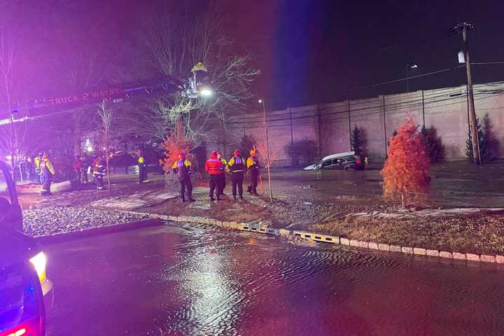 Sinkhole Swallows Car, Tractor Trailer After Water Main Breaks In Wayne