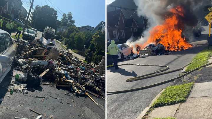 The burning trash inside the garbage truck was dumped onto the street for firefighters to put out.&nbsp;