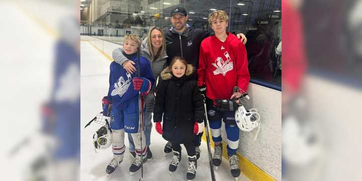 Michelle Cuccias-Weidenbach with her husband Eric and their three children.