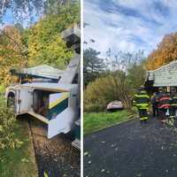 Car Rolls Down Hill Into Building, Ditch In Westchester