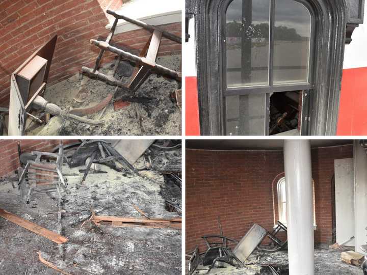 The damage at the Tarrytown Lighthouse included fire damage, broken windows, and destroyed items. 