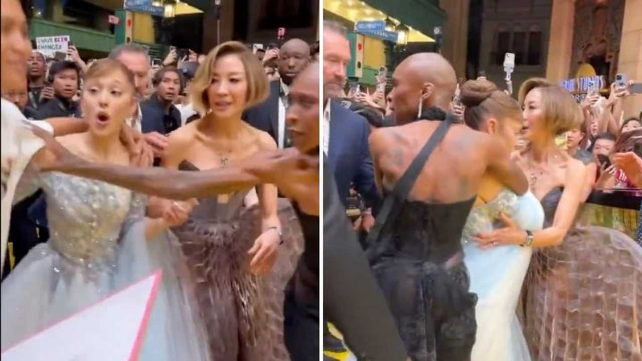 Ariana Grande reacts to a man rushing her&nbsp;at the “Wicked: For Good” premiere in Singapore on Thursday, Nov. 13.