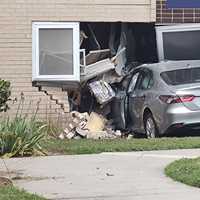 Senior Watching TV When Car Crashes Into Uniondale Apartment (DEVELOPING)