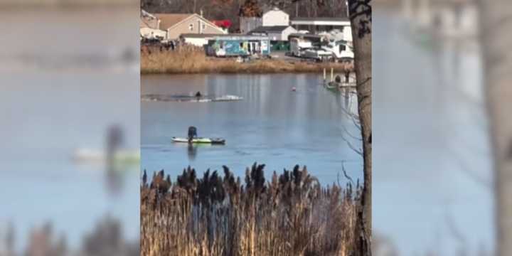 Bystander video of a good Samaritan rescuing a stranded jet skier from a frozen Poospatuck Creek in Mastic on Thursday, Dec. 26.&nbsp;
  
