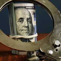 <p>Cash ands handcuffs.</p>