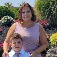 <p>Danielle Paruolo (pictured with her son) was stabbed to death inside her North Bellmore home in October 2022.</p>