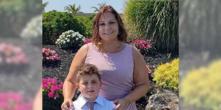 Danielle Paruolo (pictured with her son) was stabbed to death inside her North Bellmore home in October 2022.