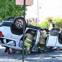 <p>The&nbsp;GMC Yukon got knocked onto its roof.</p>