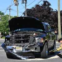 <p>Westwood firefighters cleaned up a fuel spill following the Saturday morning crash.</p>