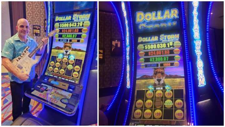 Kevin Kurtz of Freehold, NJ, stands next to a lucky slot machine&nbsp;at Hard Rock Hotel &amp; Casino Atlantic City that paid out more than half a million dollars.