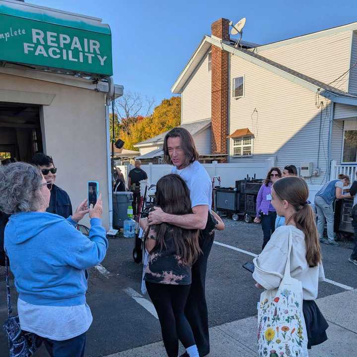 Olivia gets a hug from Hugh Jackman in Matawan.