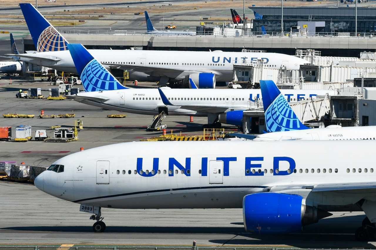 Several United Airlines planes parked at San Francisco International Airport.