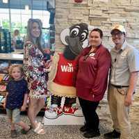 <p>Stephanie McPherson and her sons with the Route 206 Wawa staff.</p>