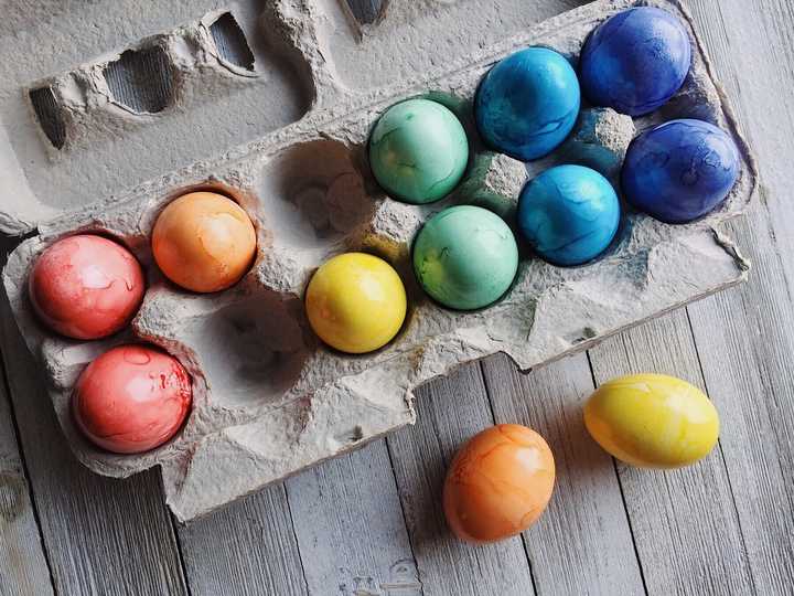 Painted Easter eggs in a carton.