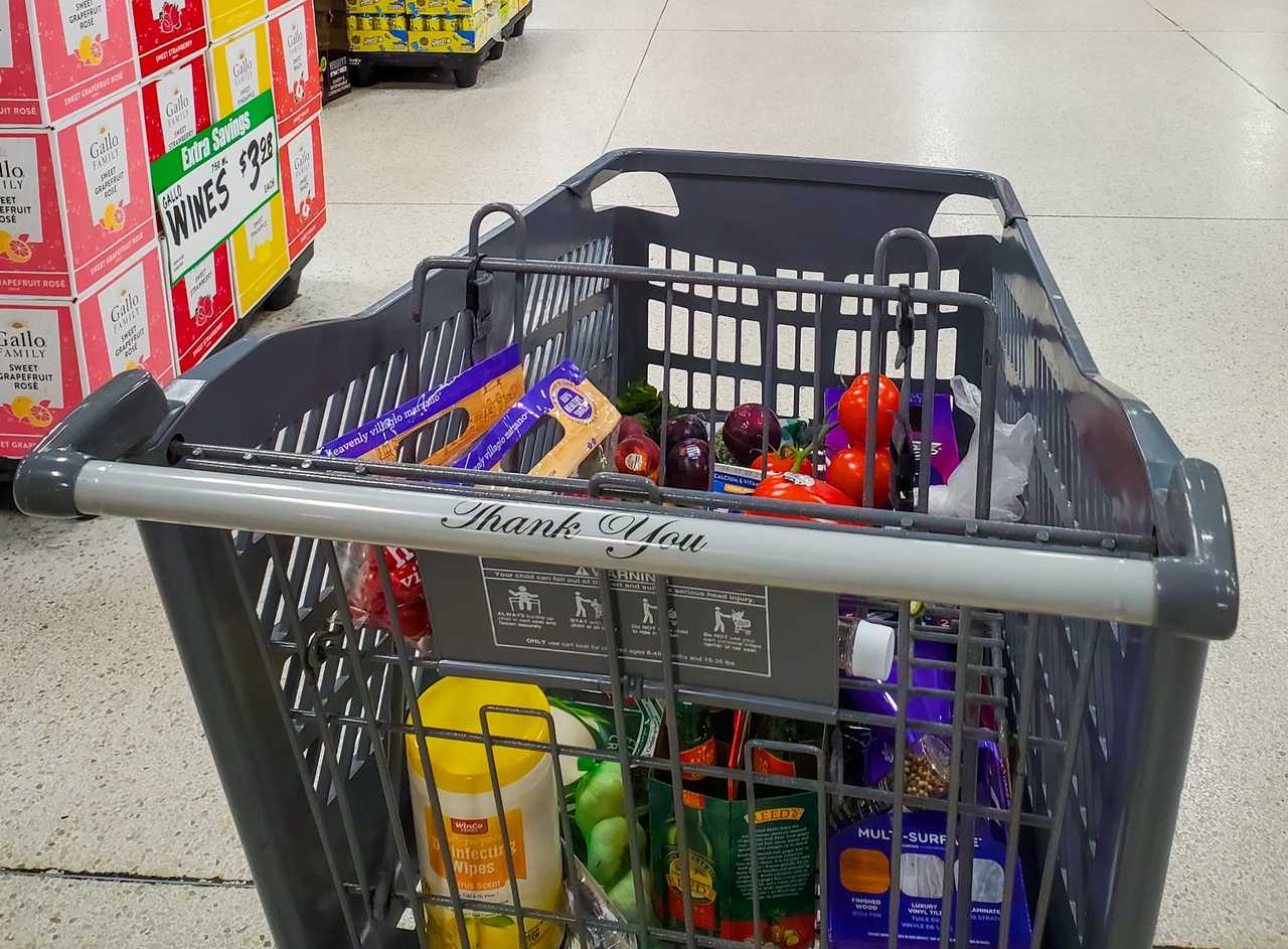 A grocery cart at a supermarket. A grocery cart at a supermarket.
