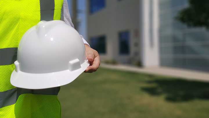 A worker with a hard hat.