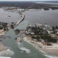 <p>Storm surge and flooding from Hurricane Sandy created a temporary inlet in Mantoloking, NJ.</p>