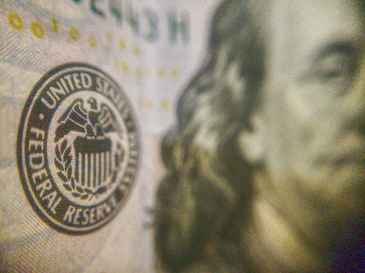 The Federal Reserve's logo on a $100 bill. The Federal Reserve's logo on a $100 bill.