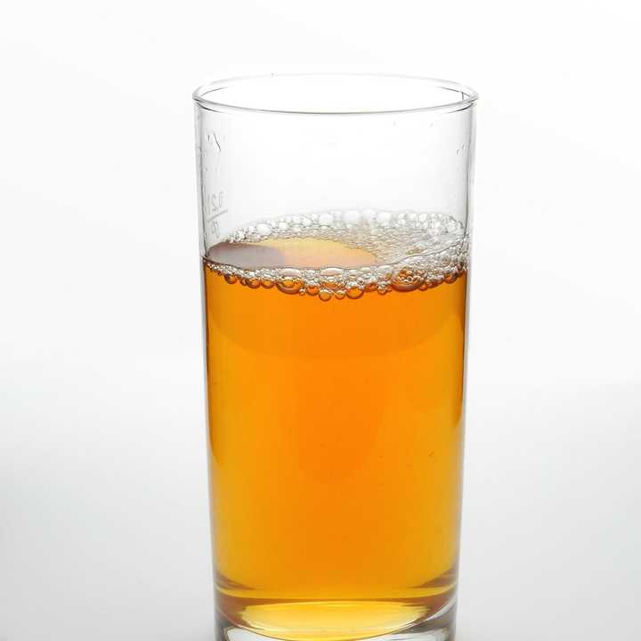 A glass of apple juice.