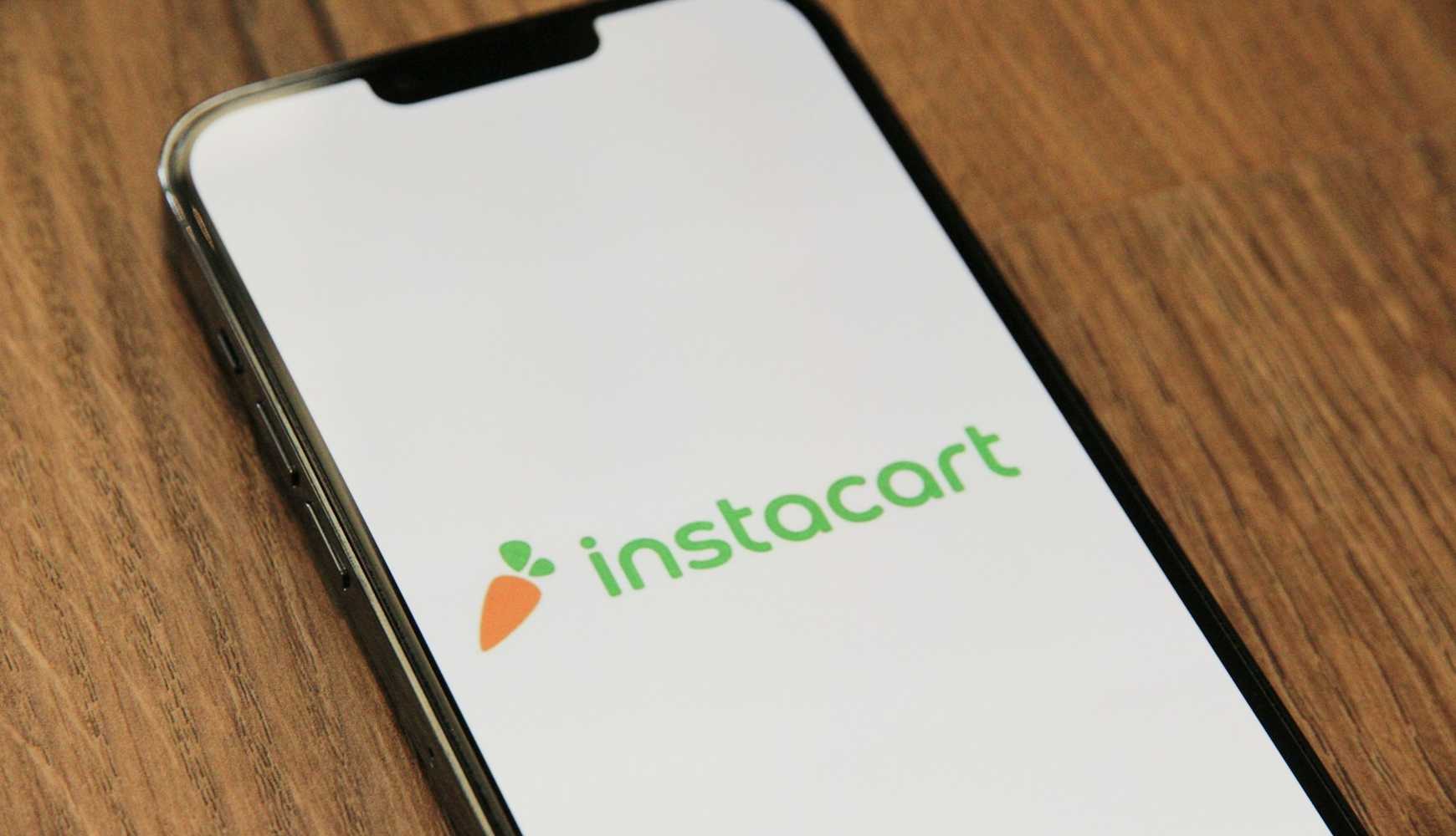 
A smartphone displaying the Instacart logo.
