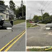 Car Strikes Utility Pole In Morganville, Knocking Out Power In Rollover Crash: Firefighters