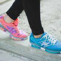 <p>A woman wearing Skechers running shoes.</p>