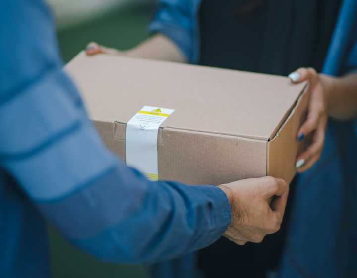 A person receiving a delivery.