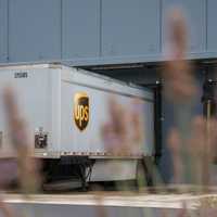 <p>A UPS tractor-trailer parked at a loading dock.</p>