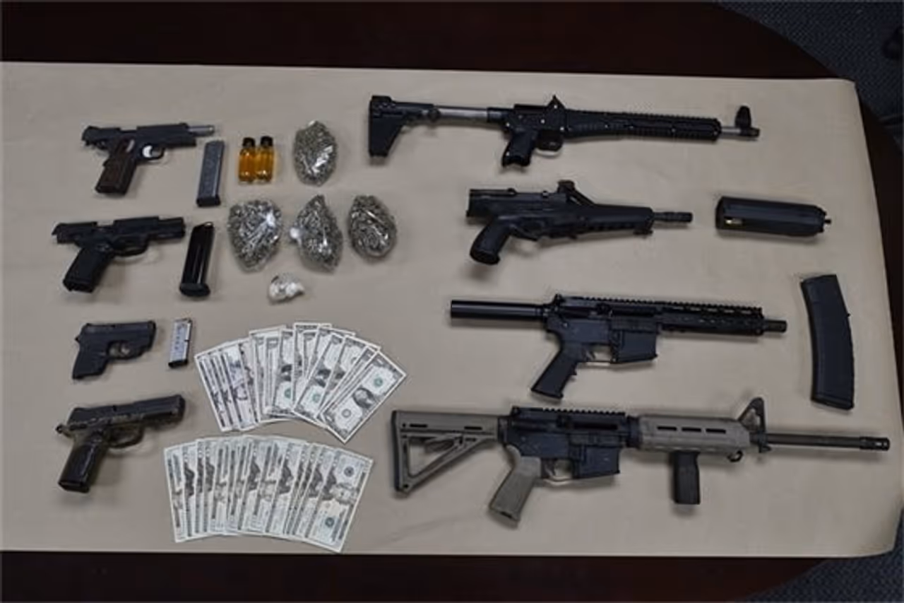 The seized weapons, drugs, and cash in Annapolis. The seized weapons, drugs, and cash in Annapolis.