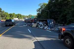 City Truck Carrying Waste Overturns On Thruway In Hudson Valley, Spills Trash