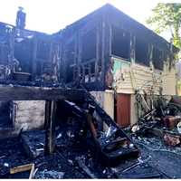 <p>Aftermath: The fierce fire destroyed the Yawpo Avenue home in Oakland before dawn Saturday, June 1.</p>